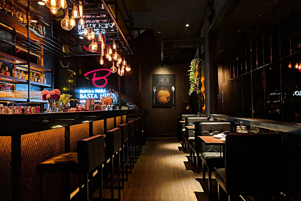 Empty chairs and tables inside a restaurant