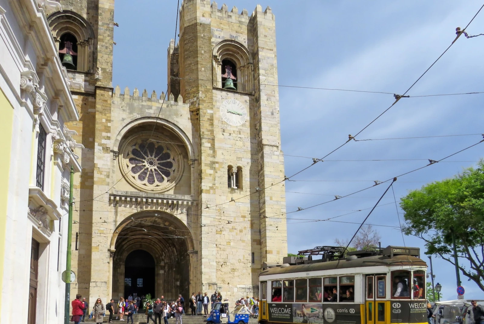 Lisbon Cathedral with a tram in front.