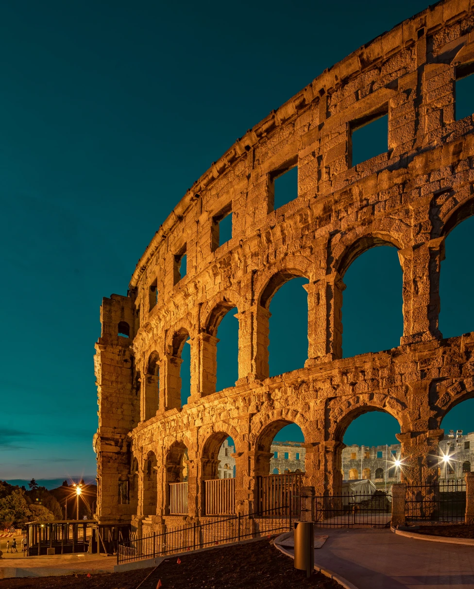 A shot of the Colosseum at night in Rome, Italy. 