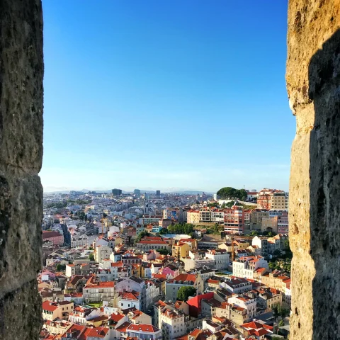 ancient city through stone wall with blue sky