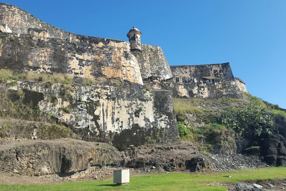 Ruins on a hill with grass.