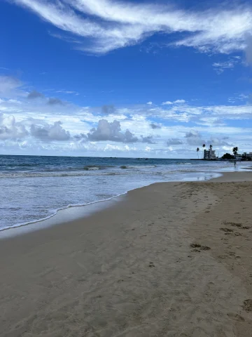 Beach on a partly cloudy day.