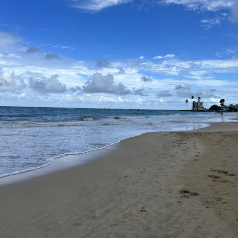 Beach on a partly cloudy day.