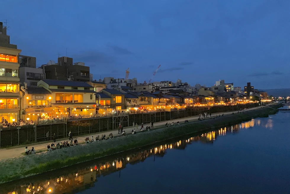 View of houses on a seaside with yellow lights