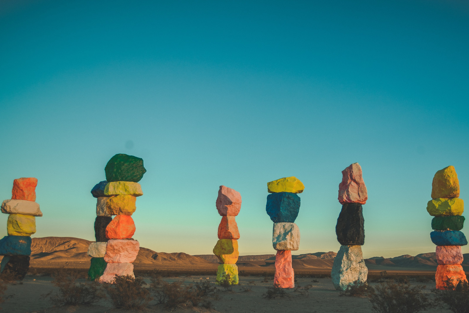 Colorful rock formations with clear skies at dusk