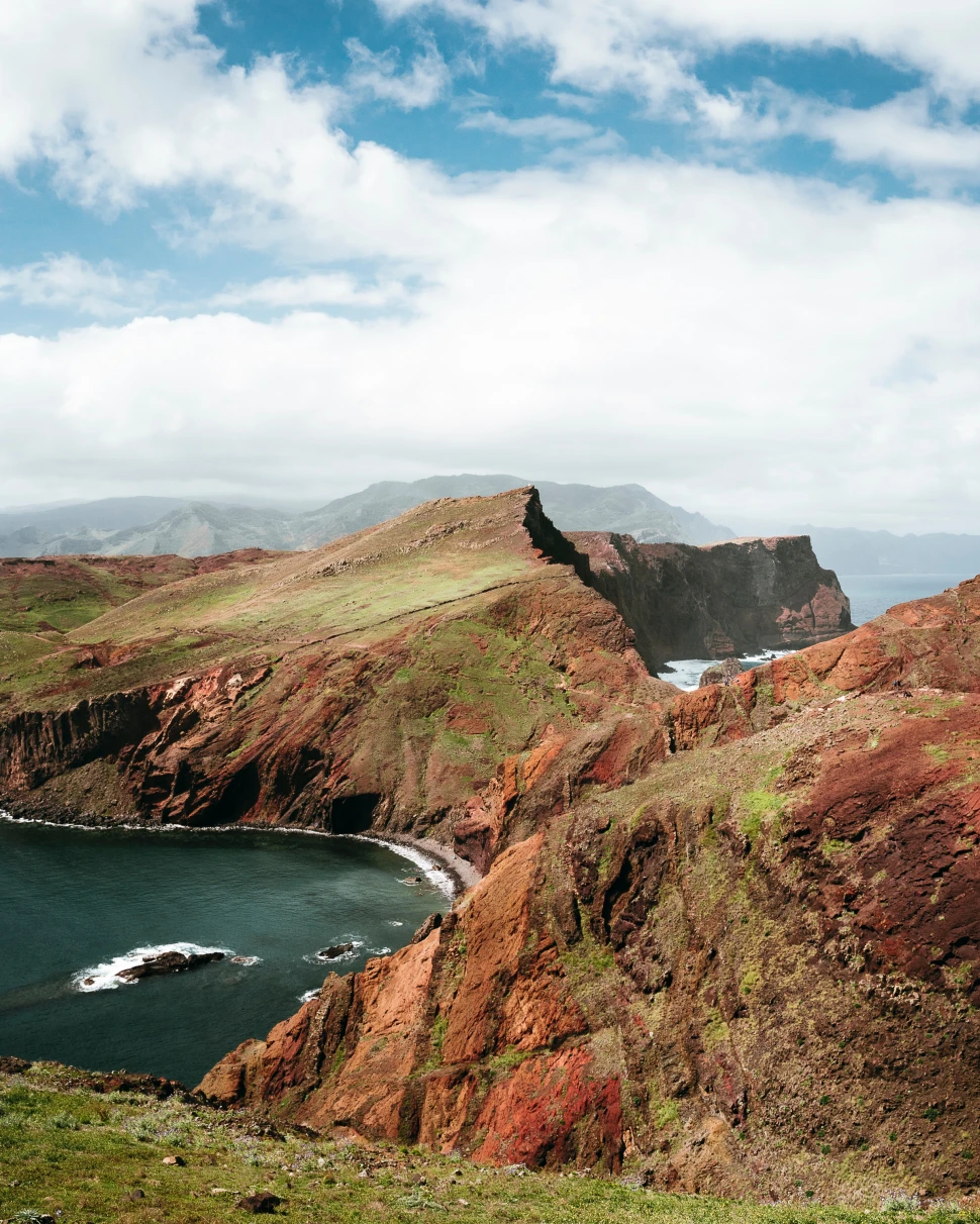 The rugged coast of Madeira against the Atlantic ocean. 