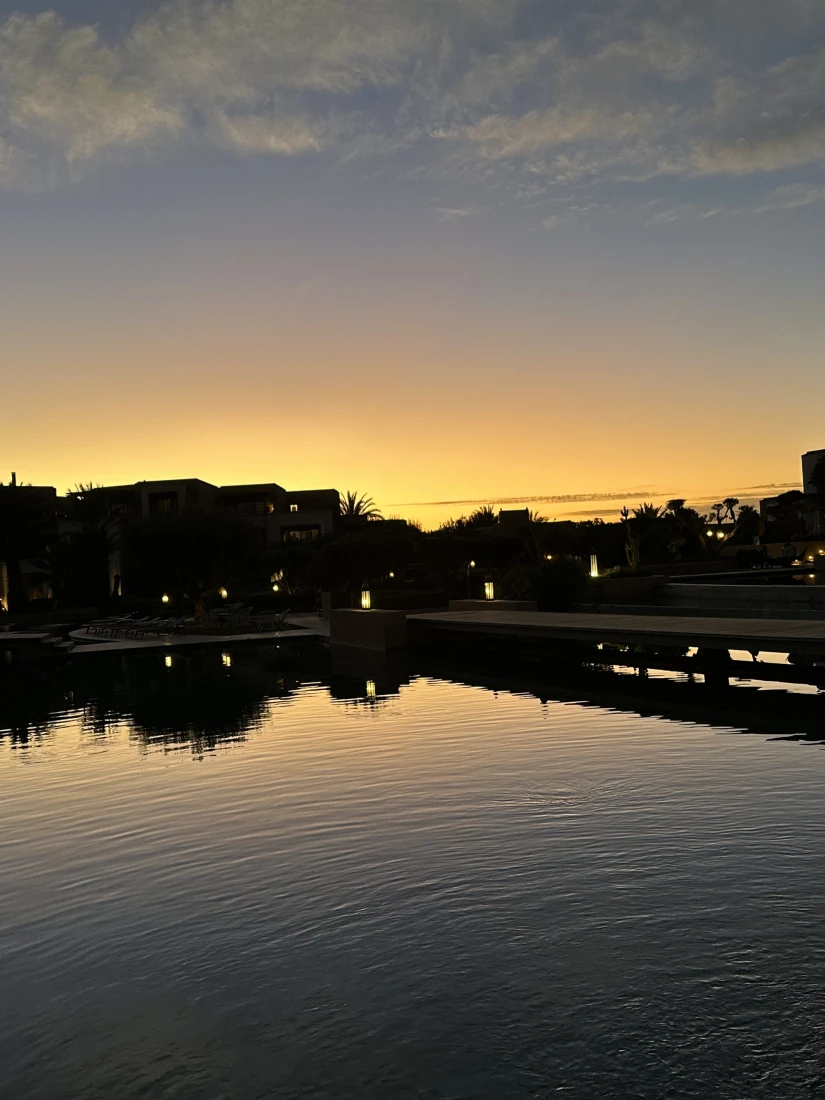 A swimming pool area during the sunset
