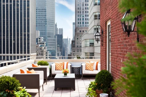 urban rooftop terrace with a brick wall