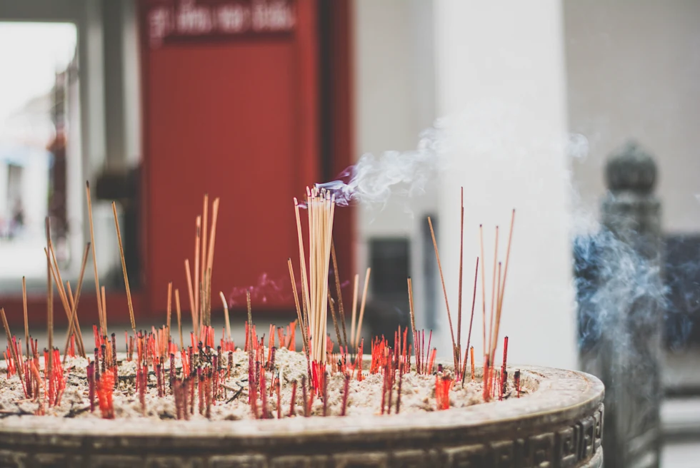 Red insence in a temple in Thailand.