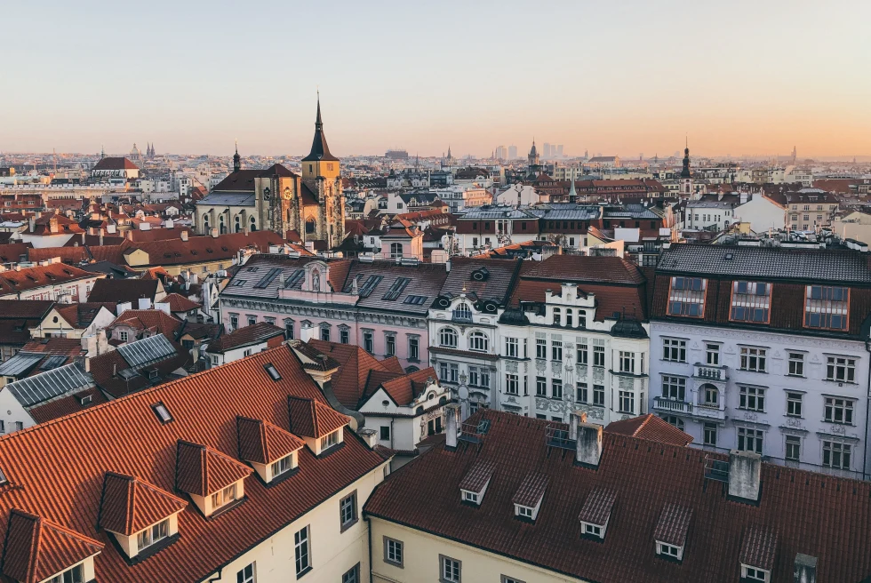 An arial shot of city showing white and brown houses