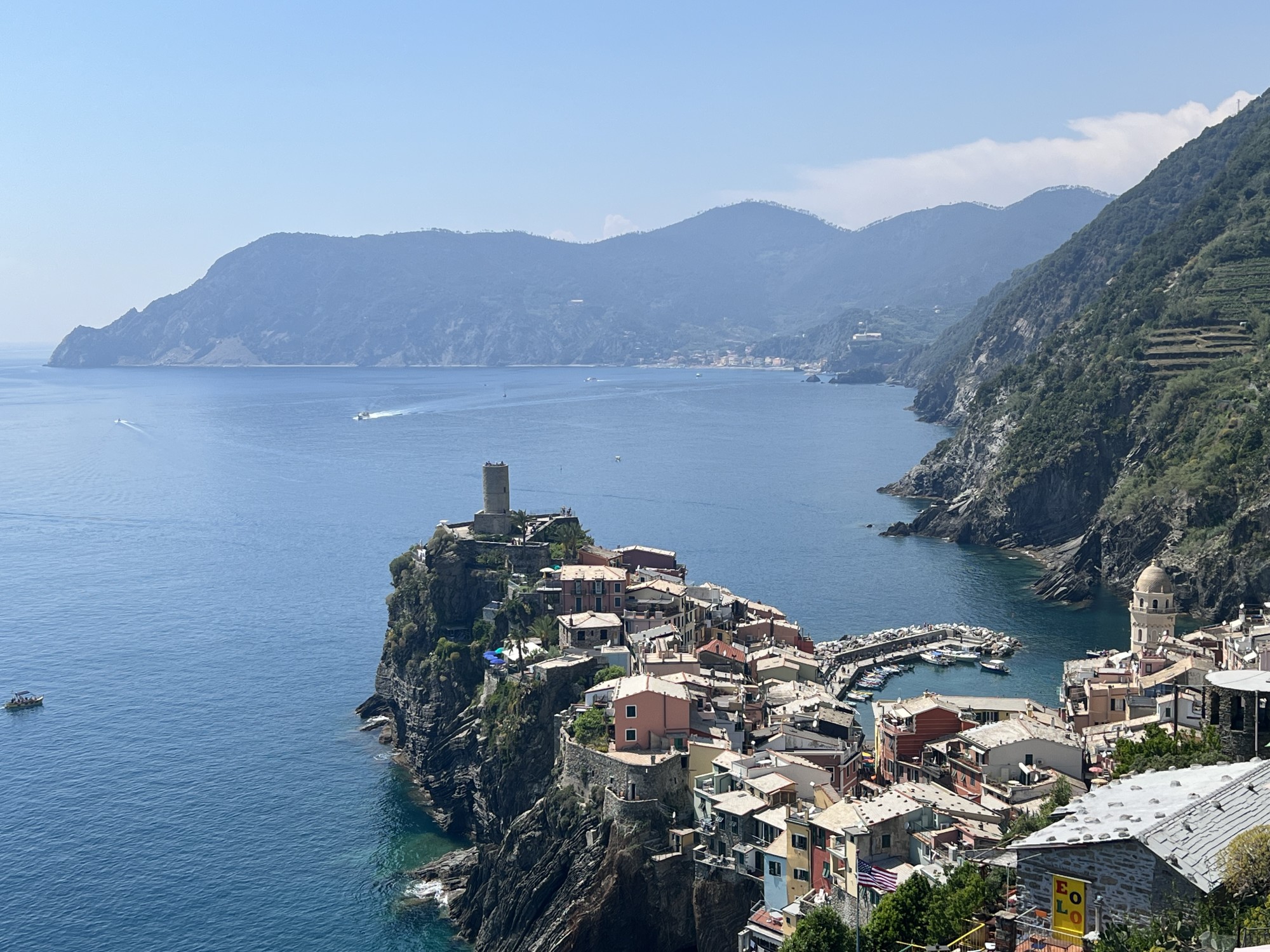 Houses on a cliff overlooking the sea. 