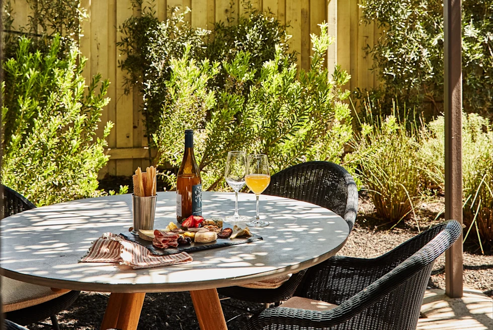 bottle of wine on table in patio during daytime
