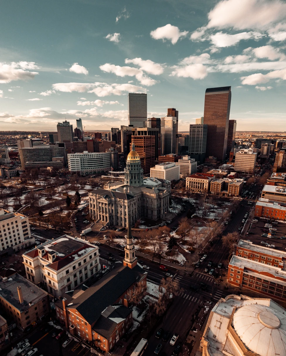 An aerial shot of the buildings of Denver, Colorado. 