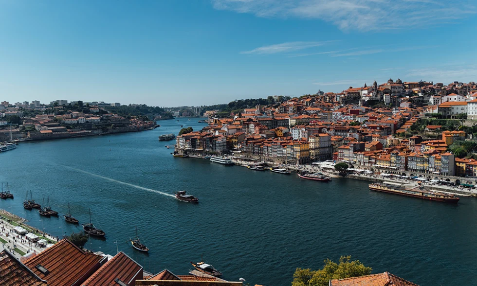 Porto Portugal blue river with boats city view