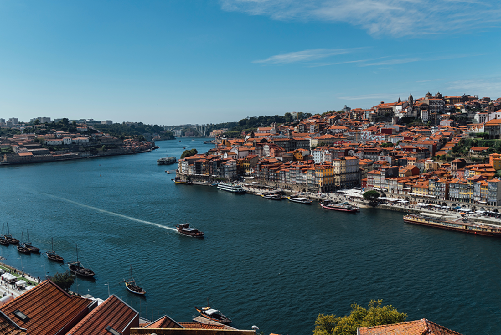 Porto Portugal blue river with boats city view