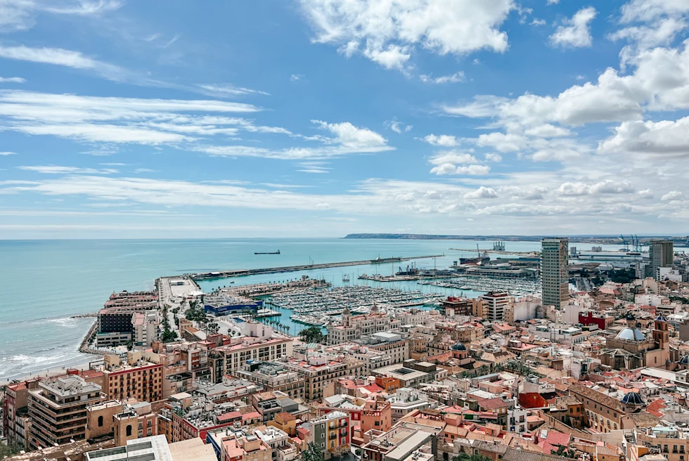 Aerial view of a city with beach on sunny day