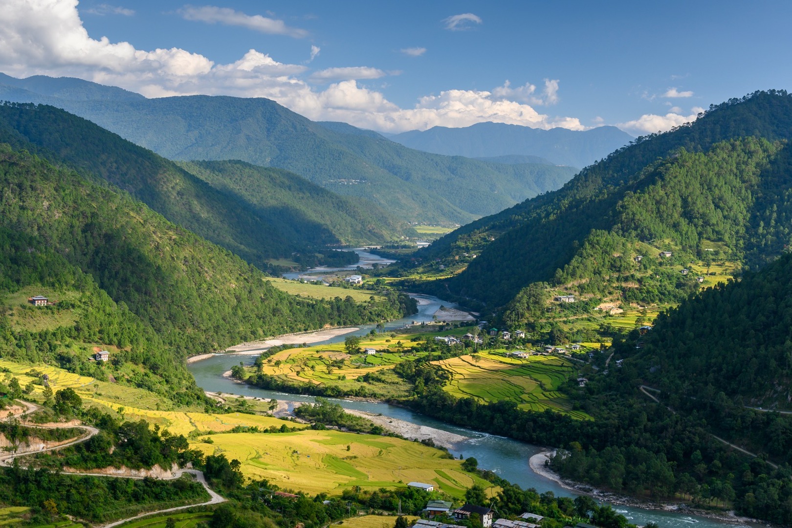 lush valley with a river snaking through it