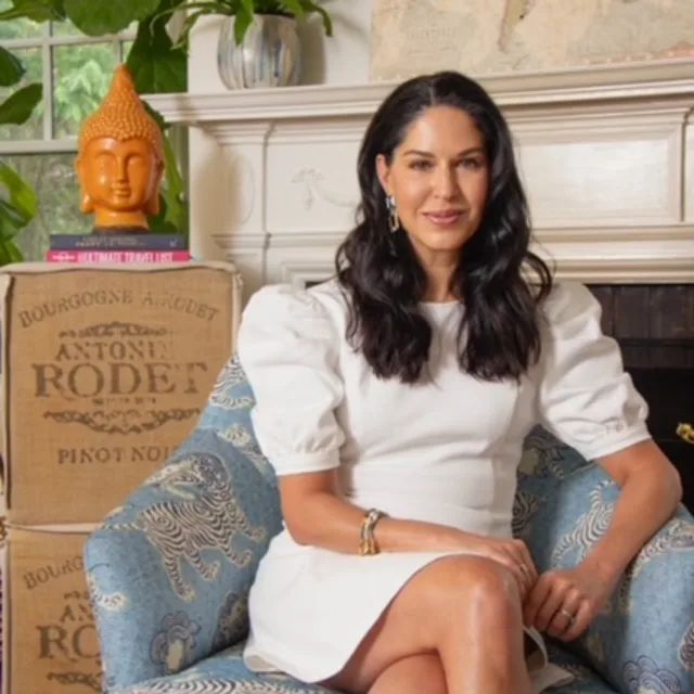 woman wearing a white dress in a blue chair