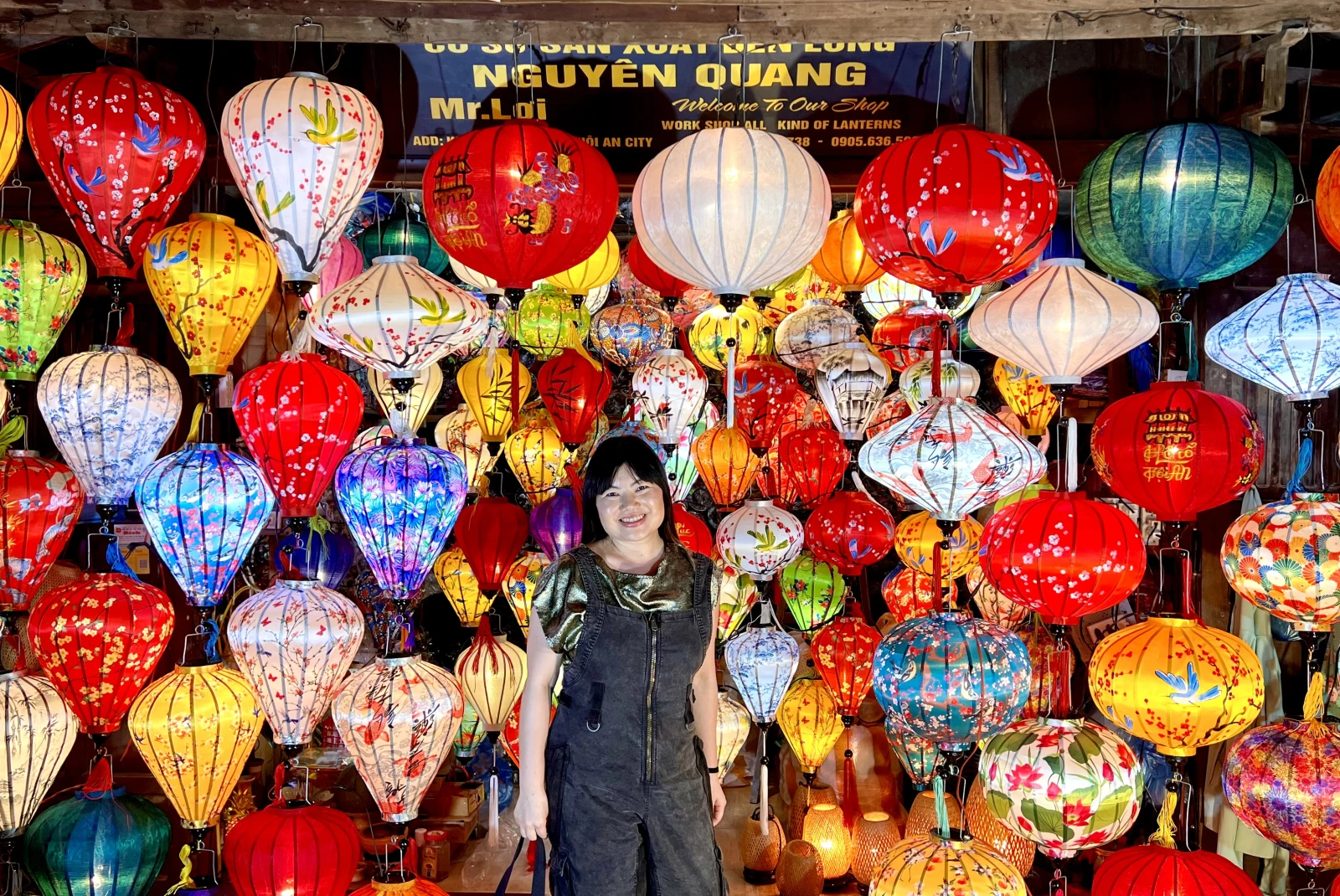 A woman selling colorful lanterns in Vietnam. 