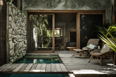 a stylish outdoor deck with a private plunge pool