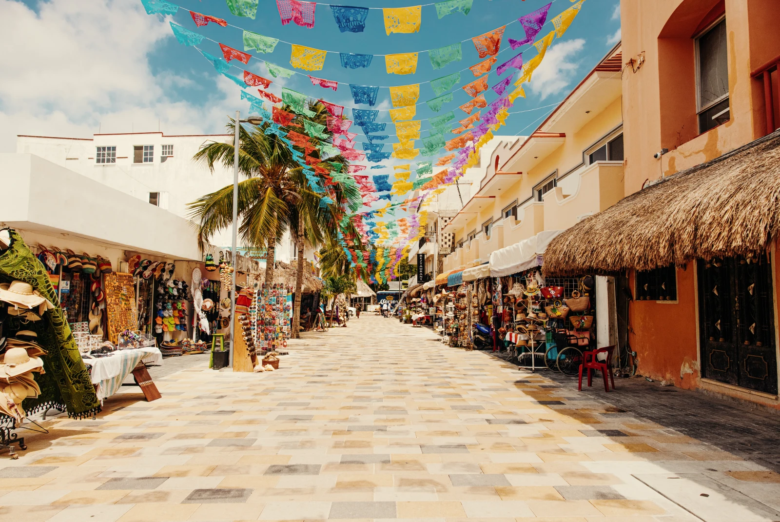 colorful flags hanging over street during daytime