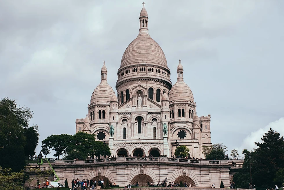 large domed building with cloudy skies