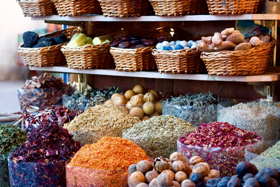 Baskets of colorful vegetables and herbs at a market in Dubai