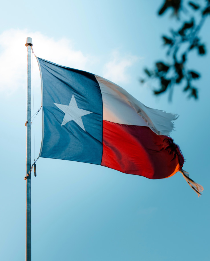 Texas flag with a blue sky in the background