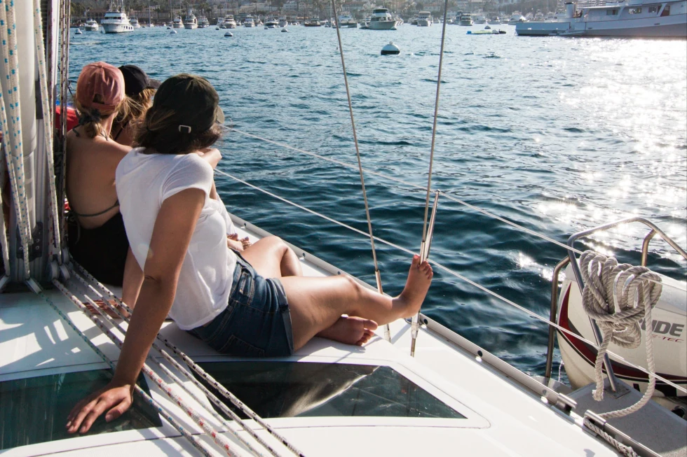 Women sitting on a sail boat. 