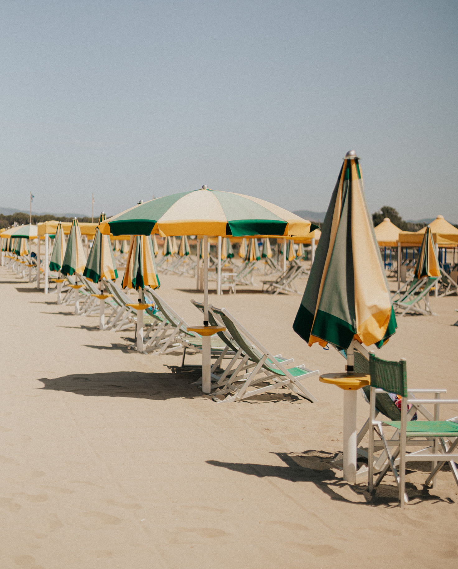 beach chairs on the sand during daytime