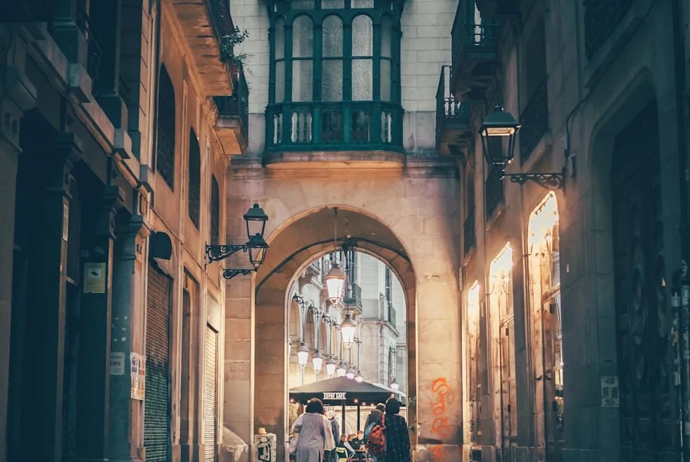 Two people walking down dark alleyway