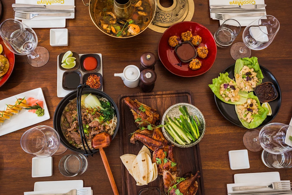 A couple standing in front of a sign that says Rum.