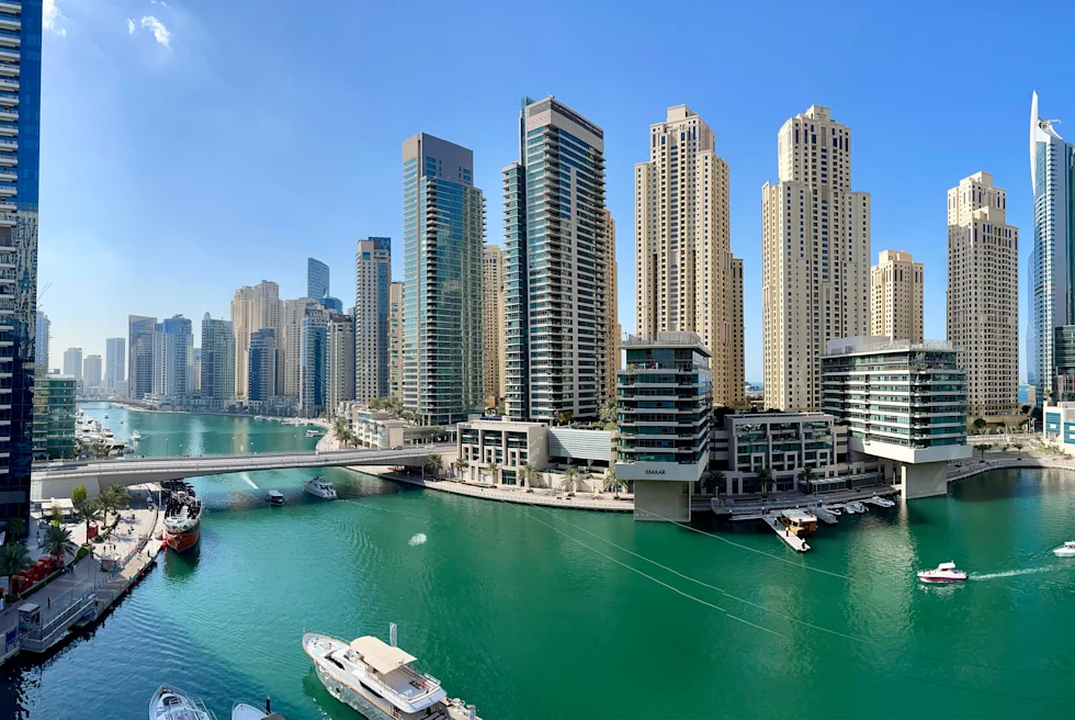 Dubai Marina featuring skyscrapers and boats.