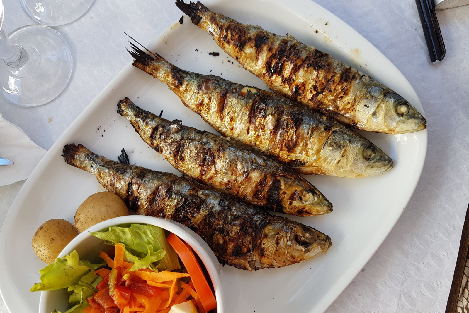 grilled fish on white plate