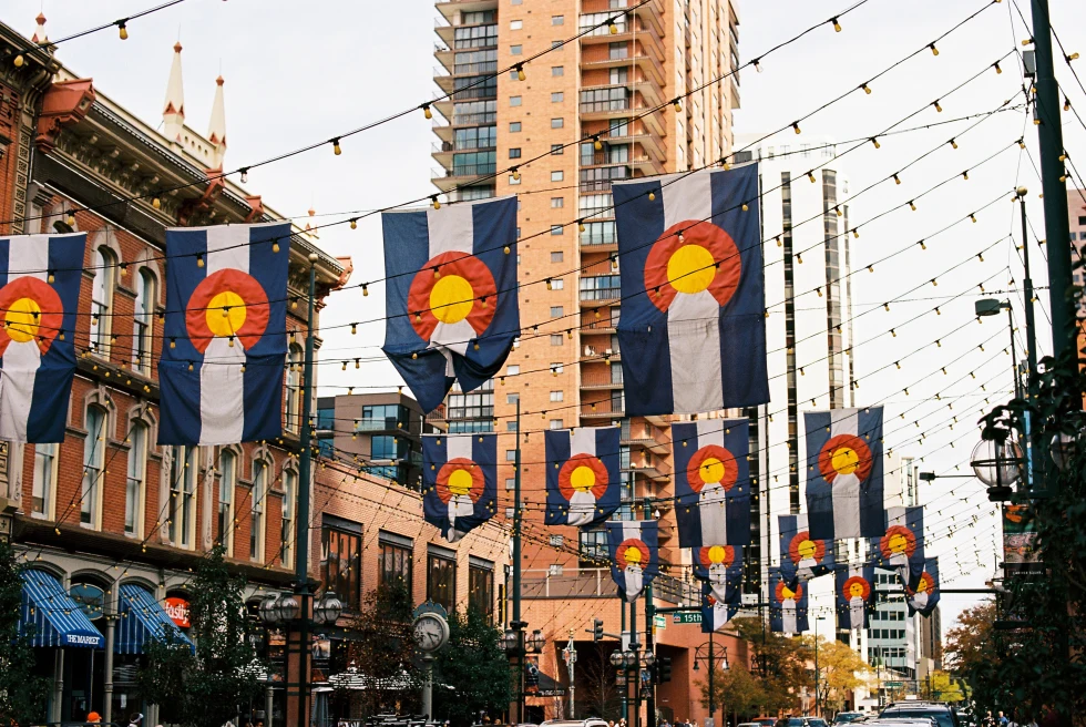 A street with hanging lights and flags.