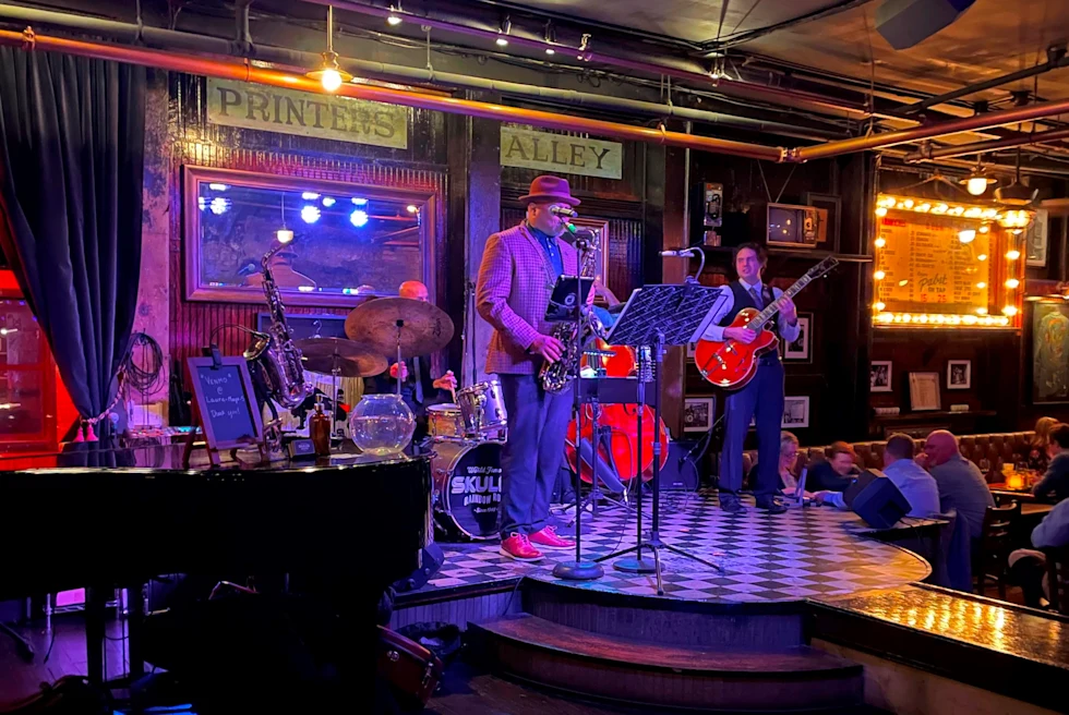 Enjoy fine food, craft cocktails, live music, and sparkling burlesque performances at Skull's Rainbow Room.