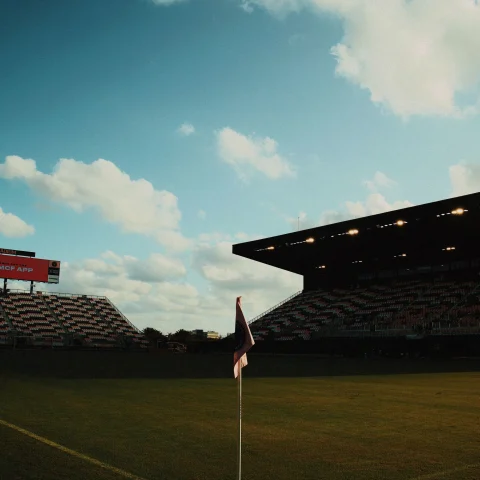 corner of a soccer field with flag at dusk