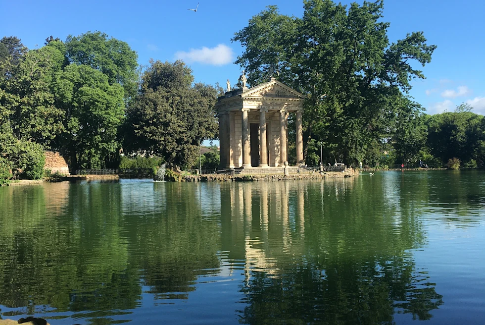large stone building near body of water during daytime