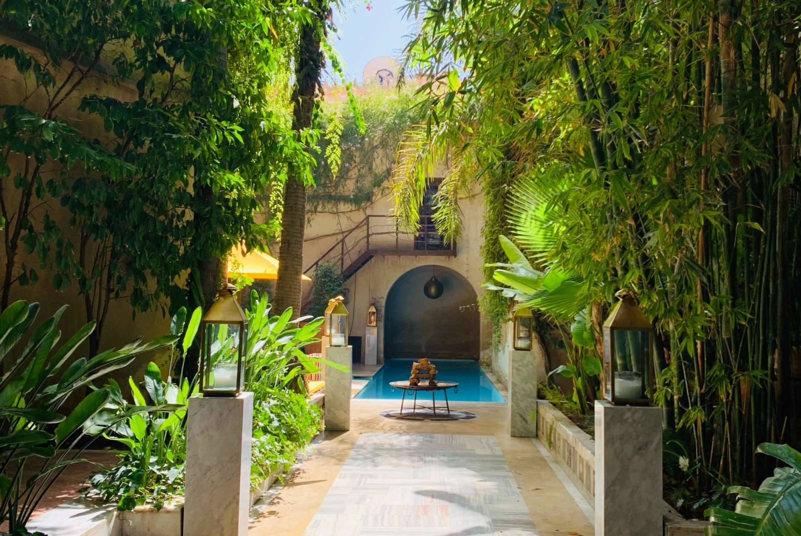 sunny pool amid a lush courtyard