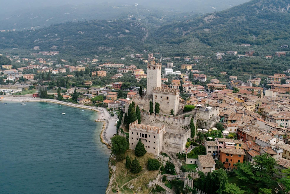 Aerial view of castle overlooking the lake.