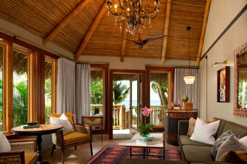 The Romance Suite at the Little Palm Island Resort, with a thatched ceiling and wraparound balcony.