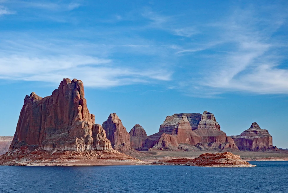 body of water with large rocks during daytime