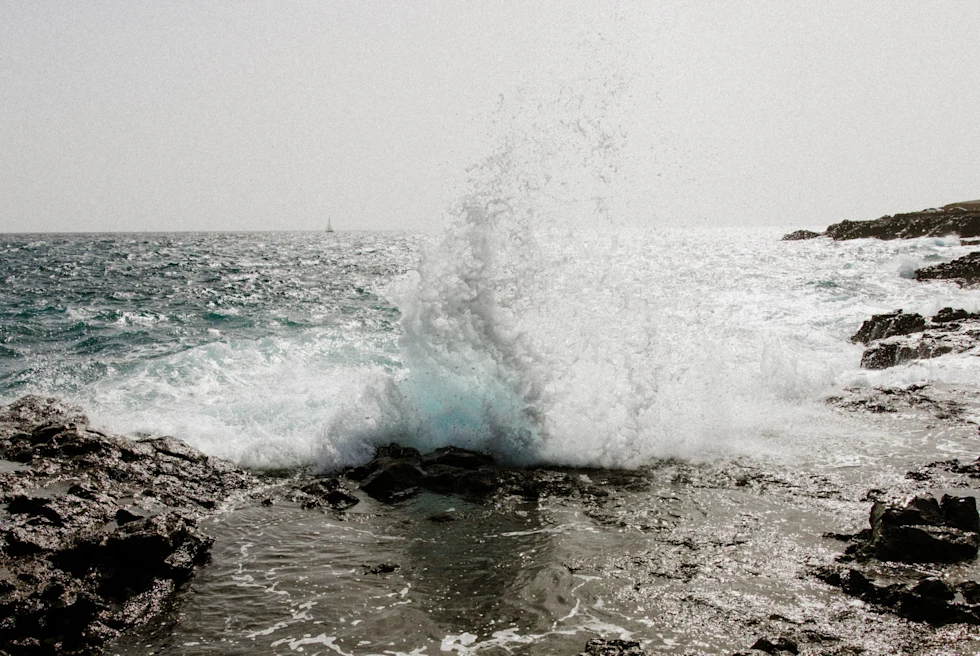 A wave striking the beach.