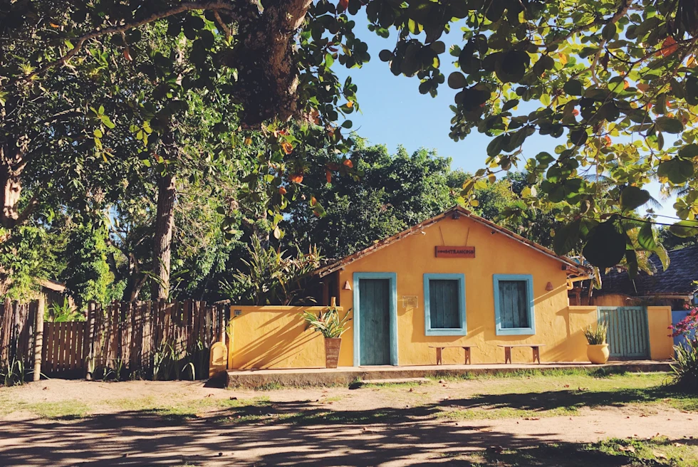 orange house next to trees during daytime