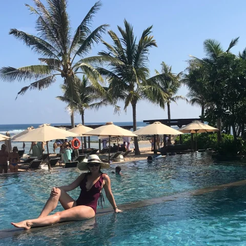 Emily laying on the pool