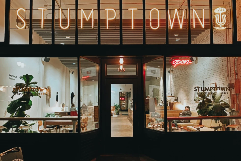 Front windows of a coffee shop read "Stumptown"
