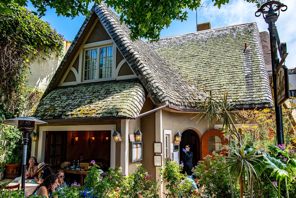 People eating in a hut shaped cafe in the carmel