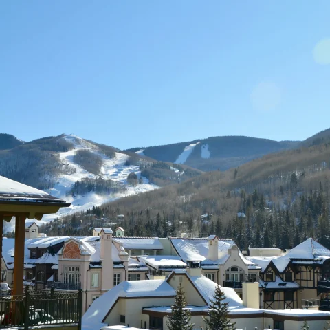 buildings with mountains in the background during daytime