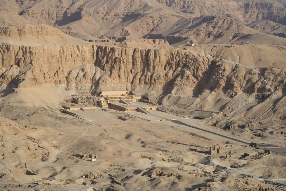 aerial view of a valley with an ancient desert city of ruins