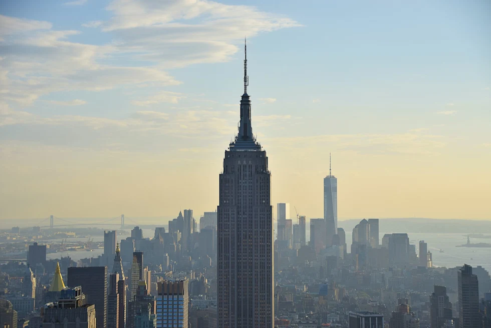 the top of empire state building on a hazy summer day